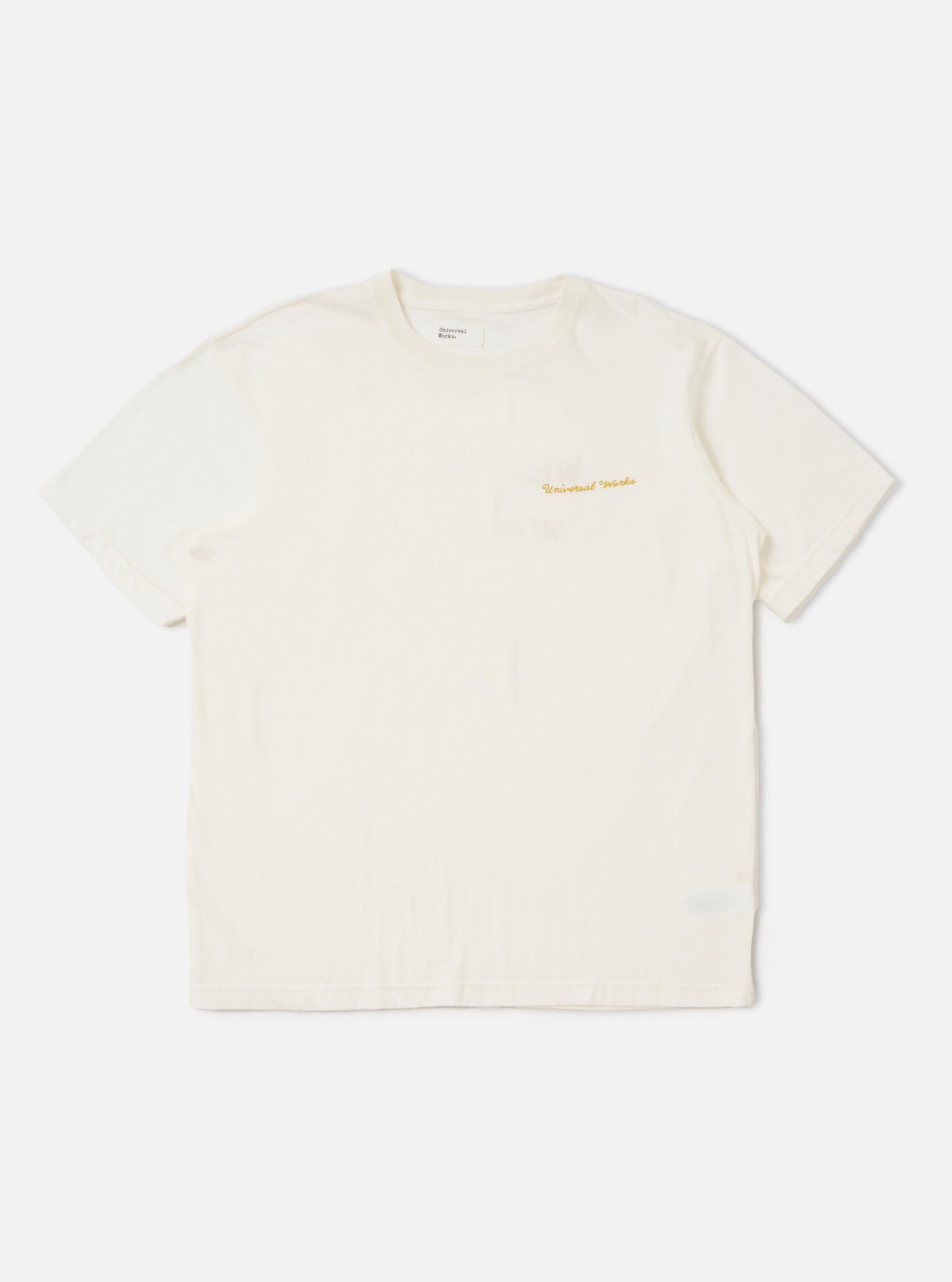 An ecru-colored Ecru Single Jersey Wish Wish You Were Here Tee is displayed flat against a plain white background. The short-sleeved t-shirt features a crew neck and a small graphic print on the left chest.