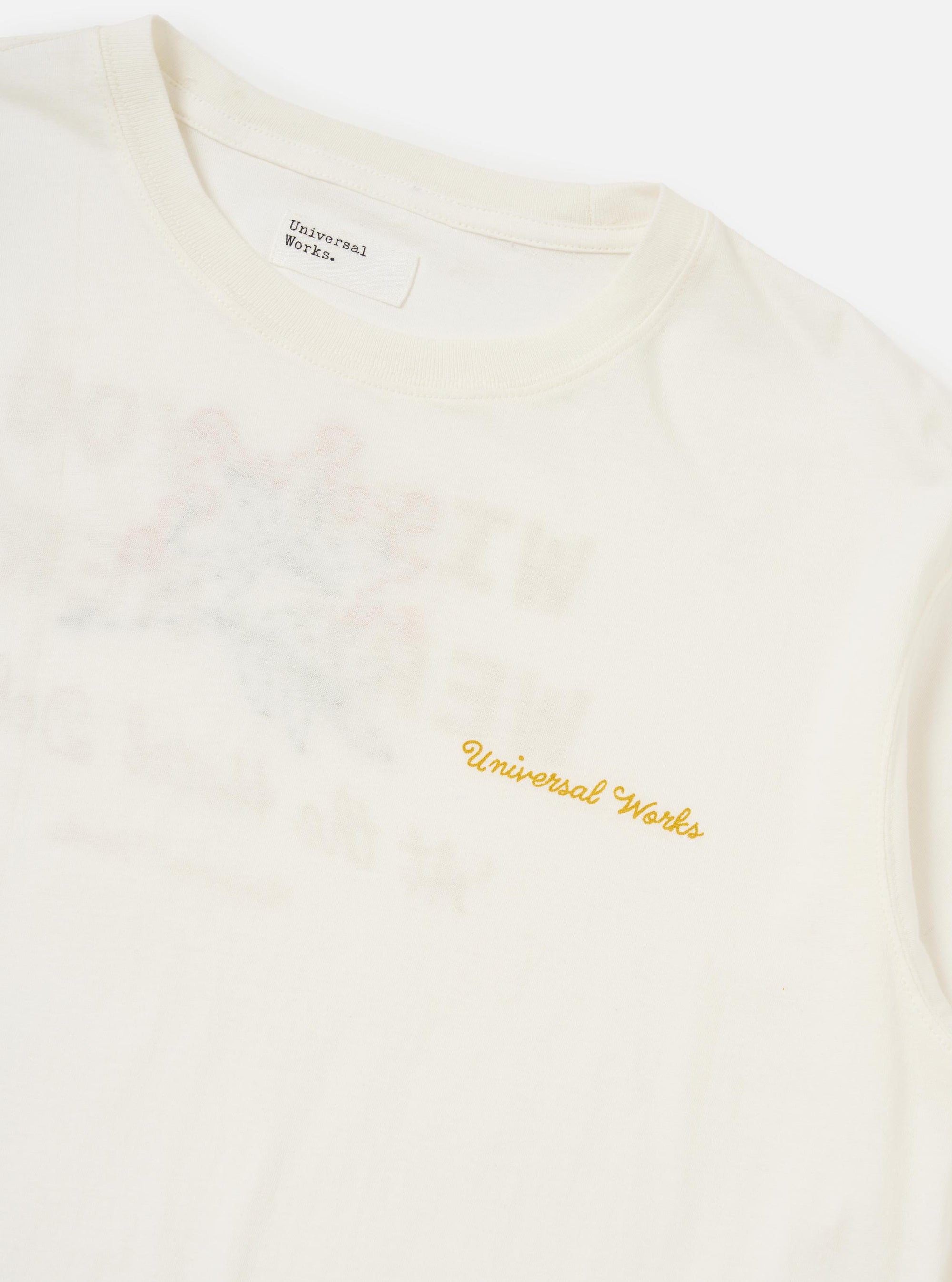 The Ecru Single Jersey Wish Wish You Were Here Tee is shown from the back, laid flat against a plain white background. The image prominently features a large "Wish You Were Here" printed graphic centered on the back, accompanied by a hand-embroidered floral spray overlay. The t-shirt has a straight hem and short sleeves.