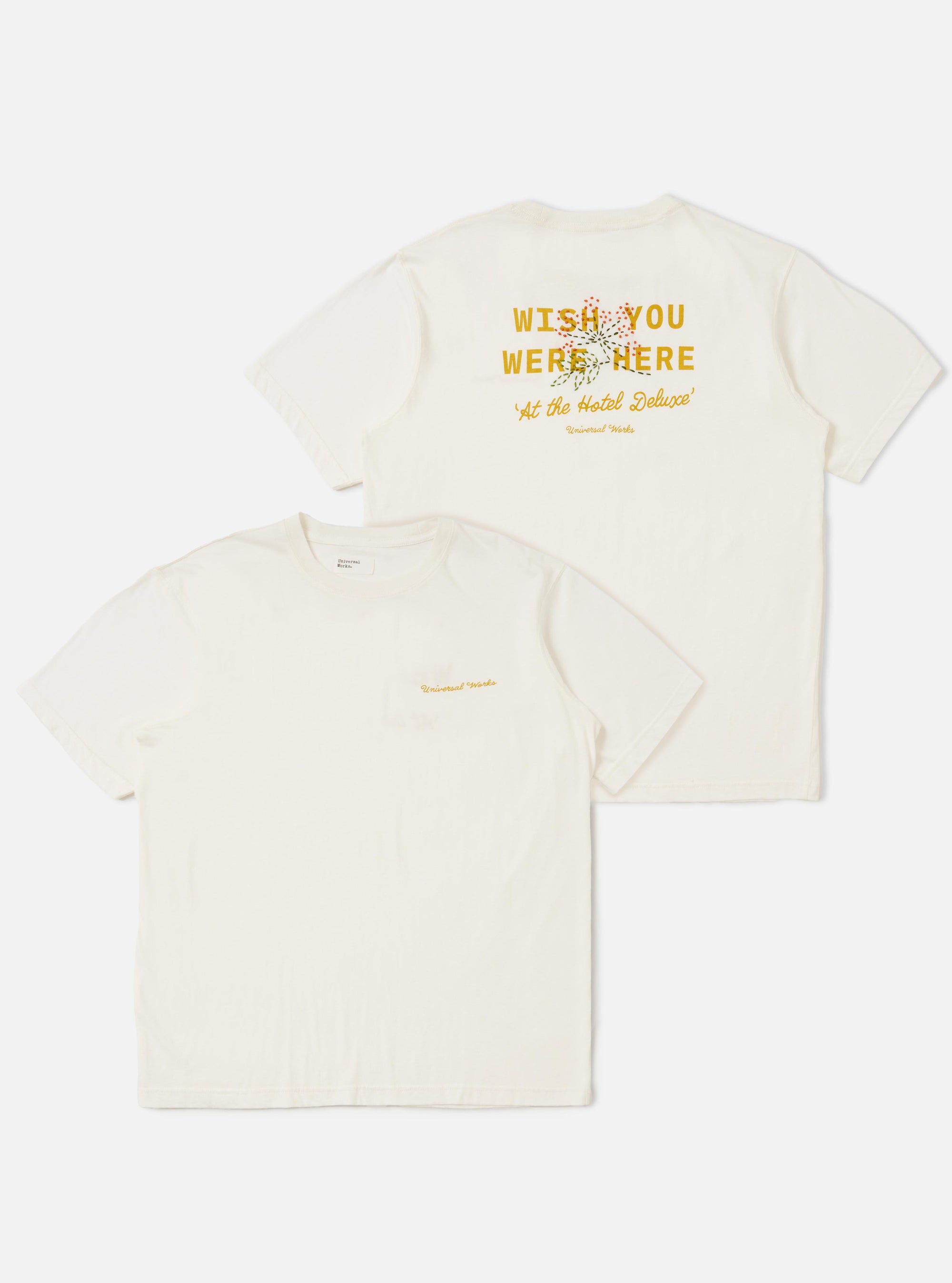 The Ecru Single Jersey Wish Wish You Were Here Tee is displayed flat against a plain white background. The shirt features two identical graphics of a tropical island scene with palm trees and the text Wish You Were Here printed on the front. It has a classic crew neck and short sleeves.