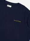 The Navy Single Jersey Wish Wish You Were Here Tee is displayed from the back, laid flat against a plain white background. The image highlights the dark navy blue cotton fabric and a small, white "Wish You Were Here" graphic printed on the upper back near the neckline.