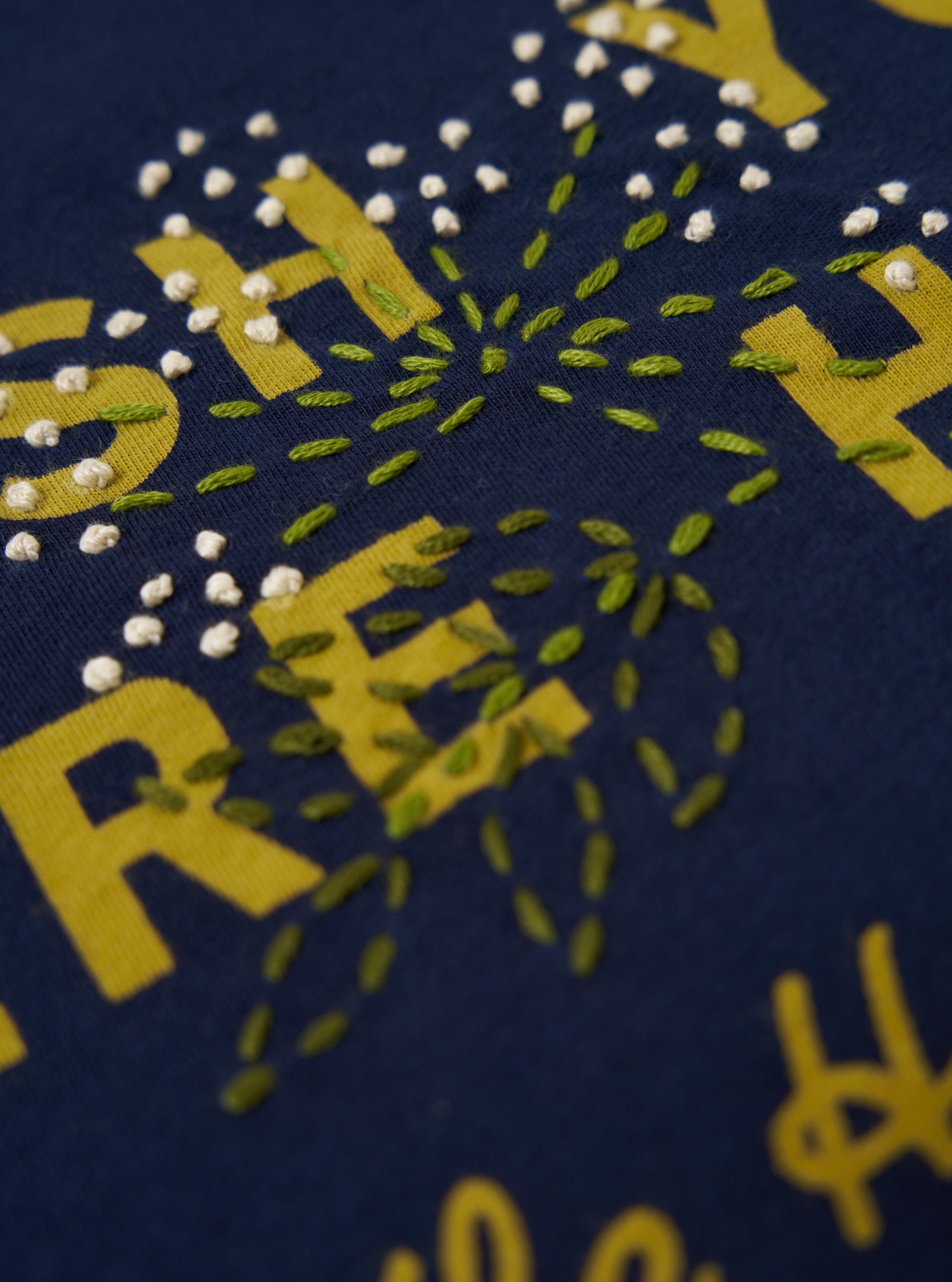 The Navy Single Jersey Wish Wish You Were Here Tee is displayed from a rear view, laid flat against a plain white background. The image highlights the back of the navy blue short-sleeved T-shirt, showing the smooth cotton jersey fabric and the straight hem.