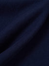 A close-up fabric swatch of the Navy Single Jersey Trail Trail To Hotel Delux Tee shows a detailed view of the navy blue cotton material. The image highlights the soft, knitted texture of the single jersey trail fabric.