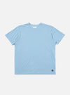 The Pale Blue Piquet Core Tee is shown laid flat against a plain white background. The short-sleeve t-shirt features a classic crew neck with a self-bound collar and a clean, regular-fit silhouette.