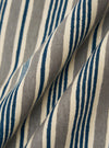 A square fabric swatch of the Grey OS Stripe Jersey Core Tee features a detailed close-up of a pale grey and white horizontal striped pattern. The fabric has a soft, irregular character with a lightweight jersey texture.