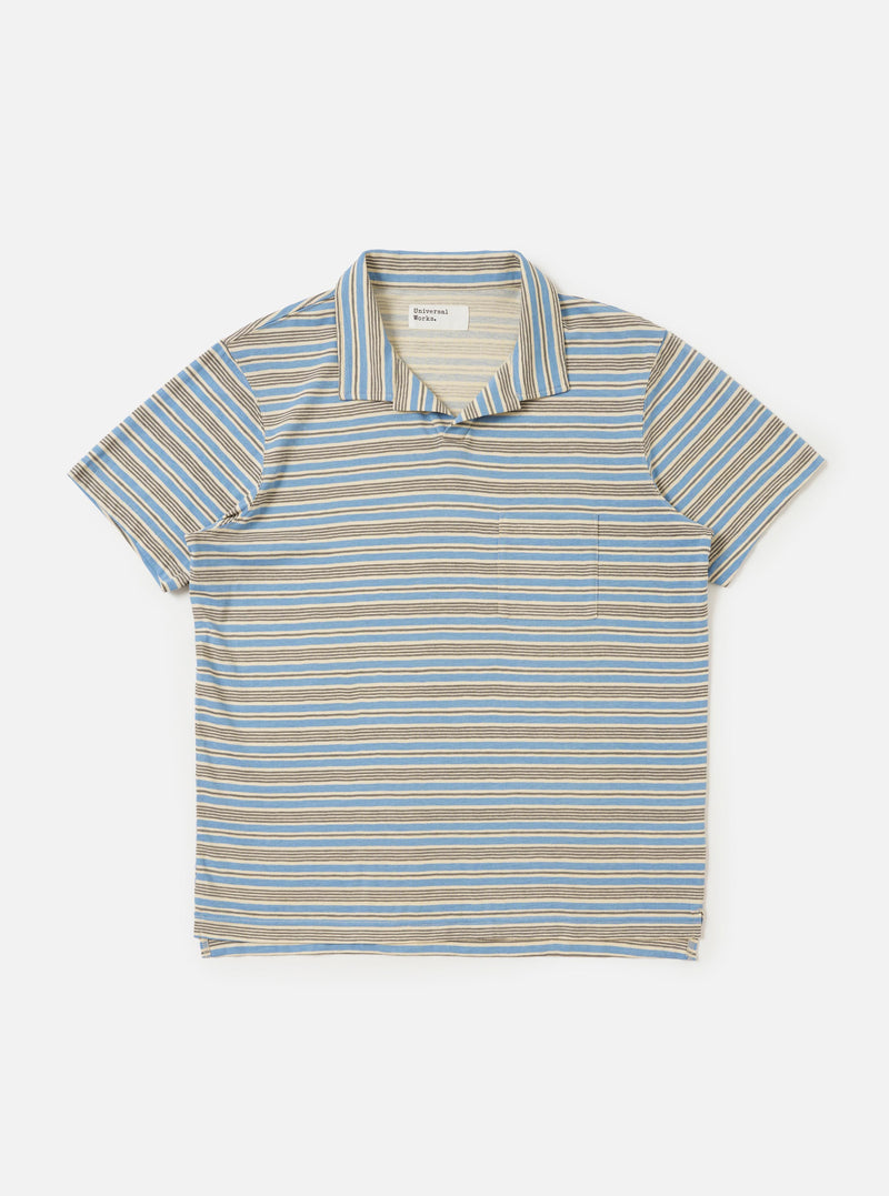 A Pale Blue OS Stripe Jersey Vacation Polo is shown laid flat against a plain white background. The garment features horizontal light blue and white stripes, a standard polo collar, and a short-sleeved silhouette.