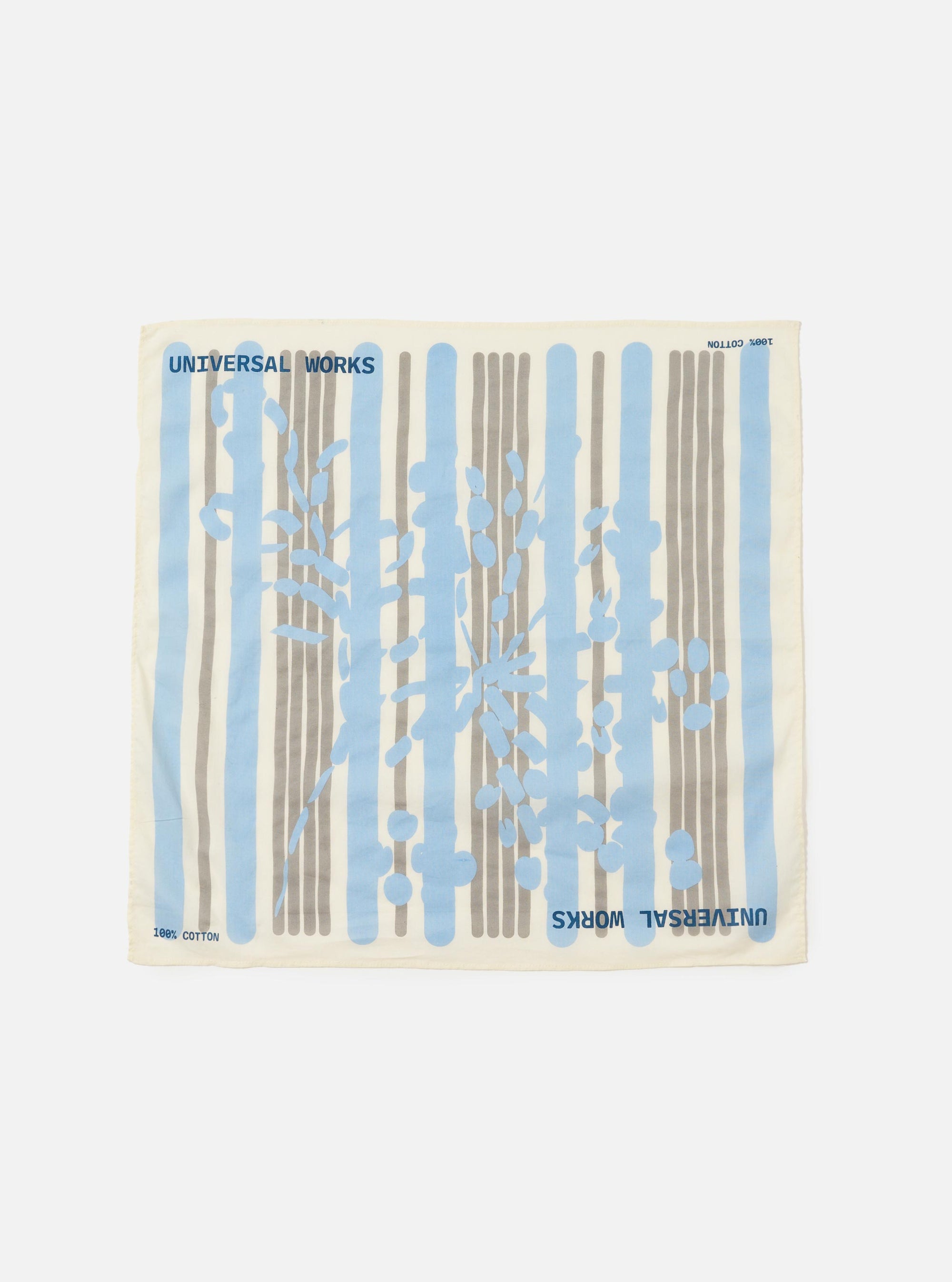 An Ecru Cambric Neckerchief is displayed flat against a plain white background. The square-shaped accessory is made of off-white cotton fabric and features a dark, intricate traditional print.