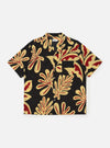 The Black Baja Print Road Shirt is shown laid flat against a solid white background. The shirt features a short-sleeve silhouette, a camp collar, and a full button-down front. It is decorated with a detailed white geometric pattern over a black cotton fabric, and a single patch pocket is visible on the left chest.