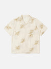 An Ecru Hand Embroidered Cotton Road Shirt is displayed flat against a plain white background. The short-sleeve shirt features a camp collar, a full button-down front, and a single patch pocket on the left chest. Intricate hand-embroidered stripe patterns in a darker thread are prominent across the entire garment.