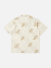 The Ecru Hand Embroidered Cotton Road Shirt is displayed from the back, laid flat against a solid white background. The shirt features a light ecru base with subtle vertical stripes and small hand-embroidered floral motifs. A clean back yoke and a straight hem are the prominent features of this view.