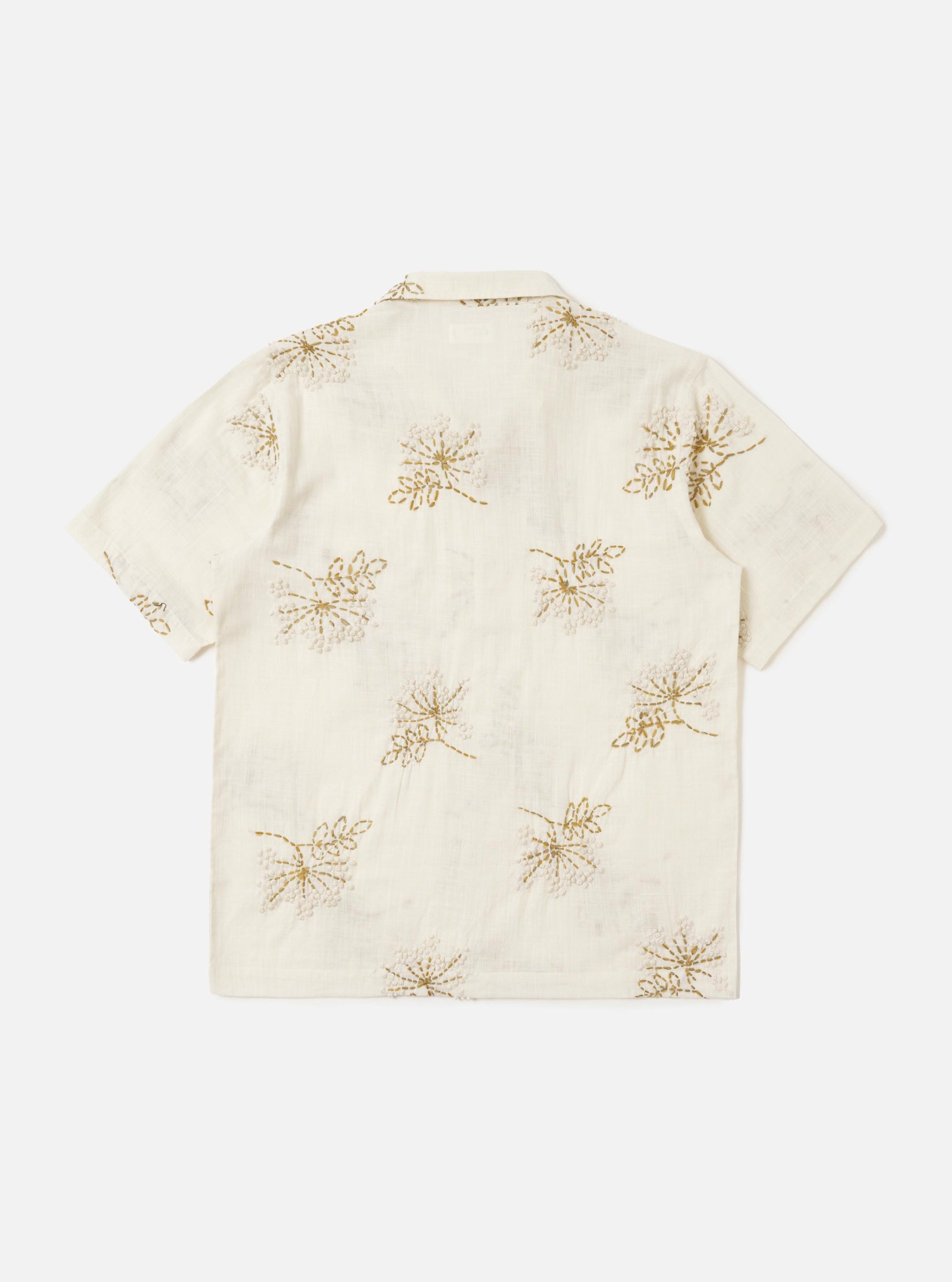 The Ecru Hand Embroidered Cotton Road Shirt is displayed from the back, laid flat against a solid white background. The shirt features a light ecru base with subtle vertical stripes and small hand-embroidered floral motifs. A clean back yoke and a straight hem are the prominent features of this view.