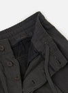 The Charcoal Seattle Cotton Pleated Track Pant is displayed flat against a plain white background. The charcoal grey trousers feature a relaxed fit with a tapered leg, a single pleat on each leg for added volume, and an elasticated waistband with a visible drawstring.