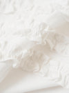 A close-up fabric swatch of the White Poplin Frill Shirt highlights the fine, smooth weave and crisp texture of the white cotton poplin material. The image focuses solely on the detail of the fabric against a neutral background.