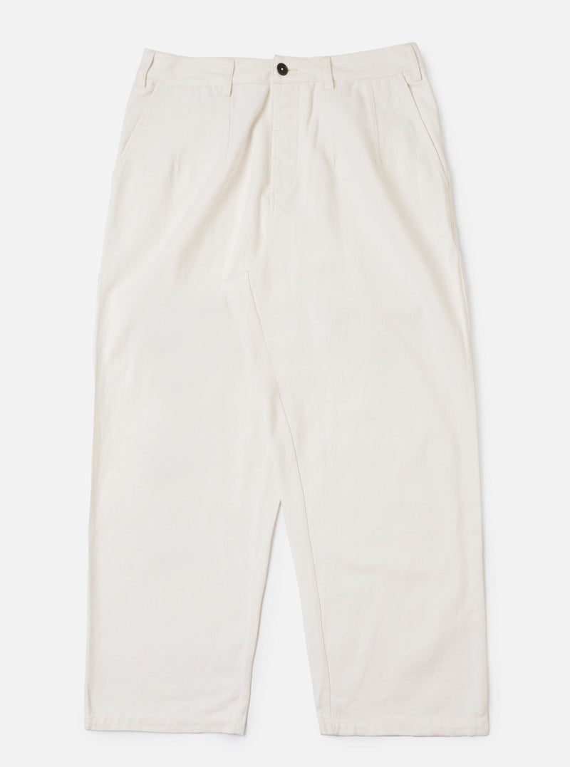 A pair of Ecru Slub Drill Dutch Pants is displayed flat against a plain white background. The trousers feature a loose, wide-leg fit, side slip pockets, and a buttoned waistband with belt loops.