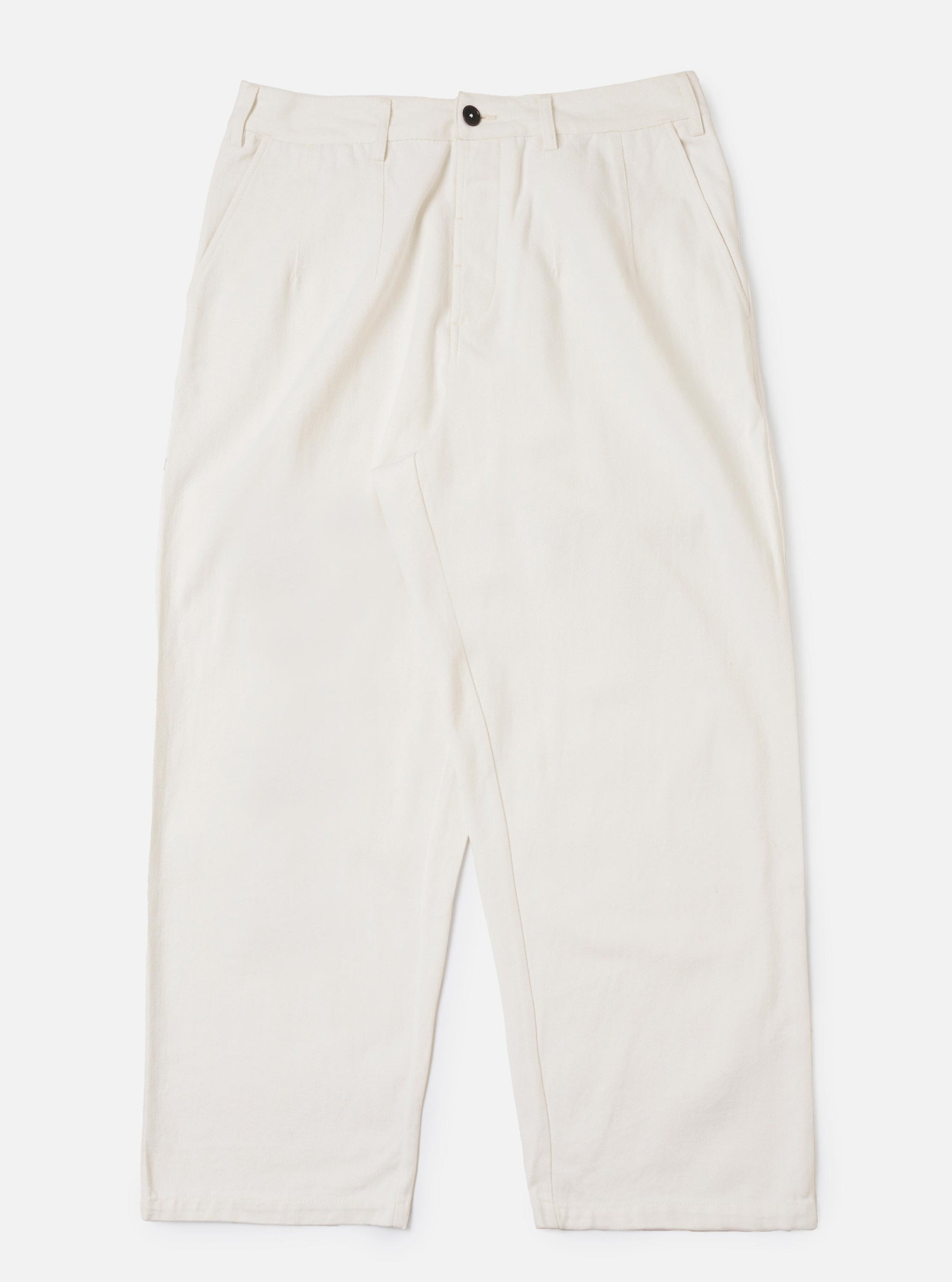 A pair of Ecru Slub Drill Dutch Pants is displayed flat against a plain white background. The trousers feature a loose, wide-leg fit, side slip pockets, and a buttoned waistband with belt loops.