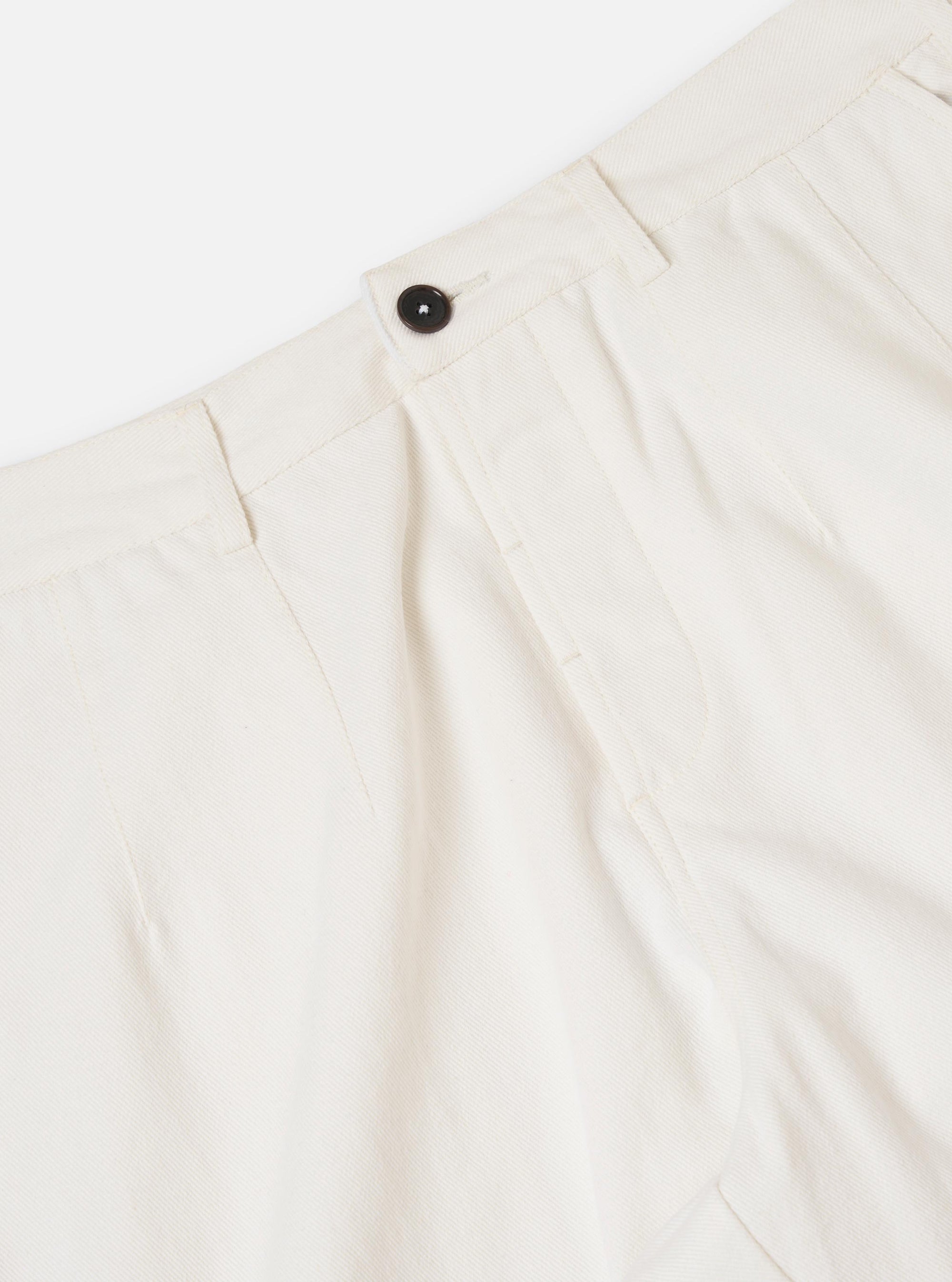The Ecru Slub Drill Dutch Pant is shown from a rear angle, laid flat against a solid white background. The image highlights the wide-leg cut, the textured ecru cotton fabric, and two large rear patch pockets.