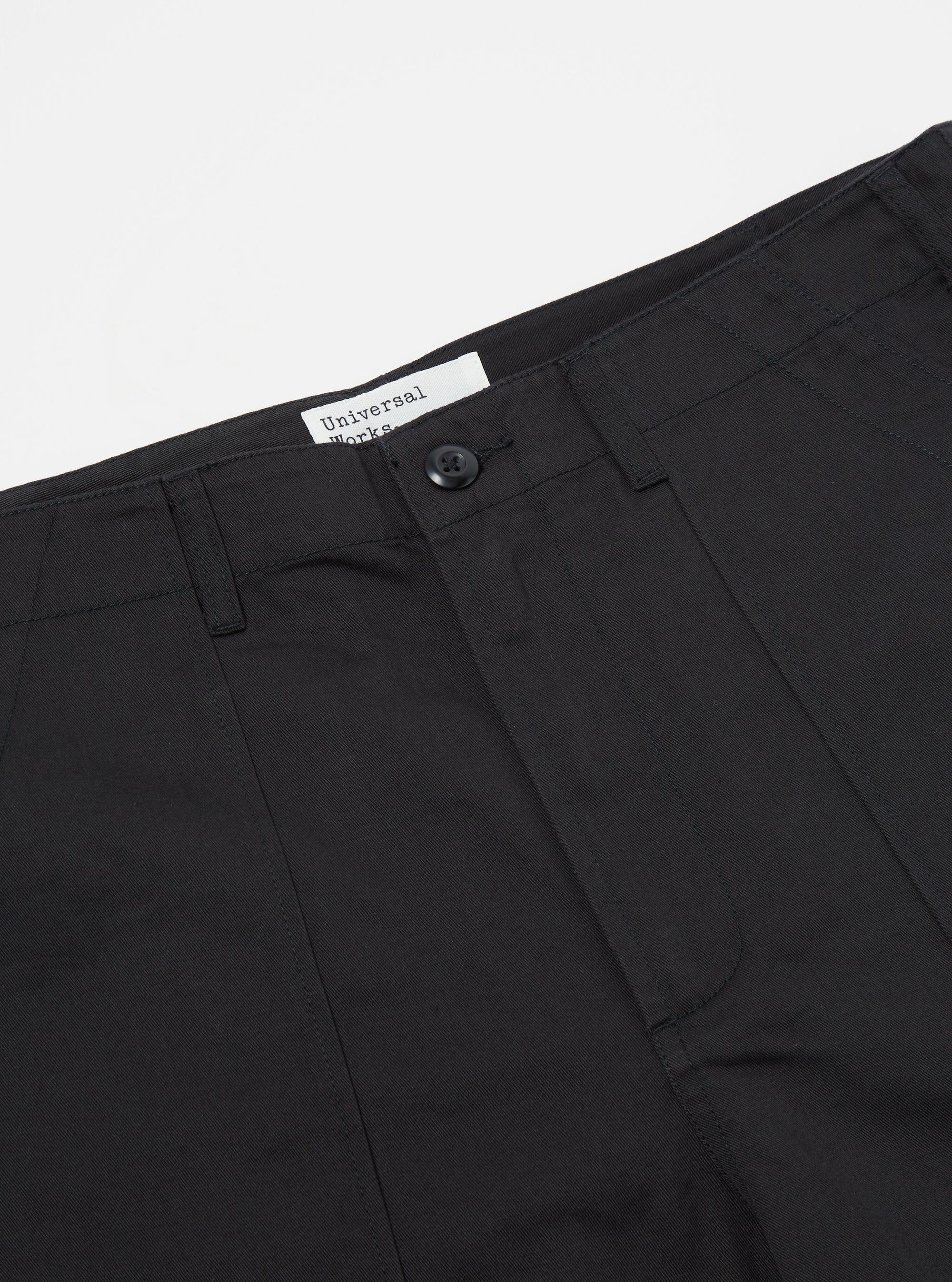 Close-up of the Black Twill Fatigue Pant (Undarted) on a white surface. The dark twill fabric and classic cut are clearly visible.