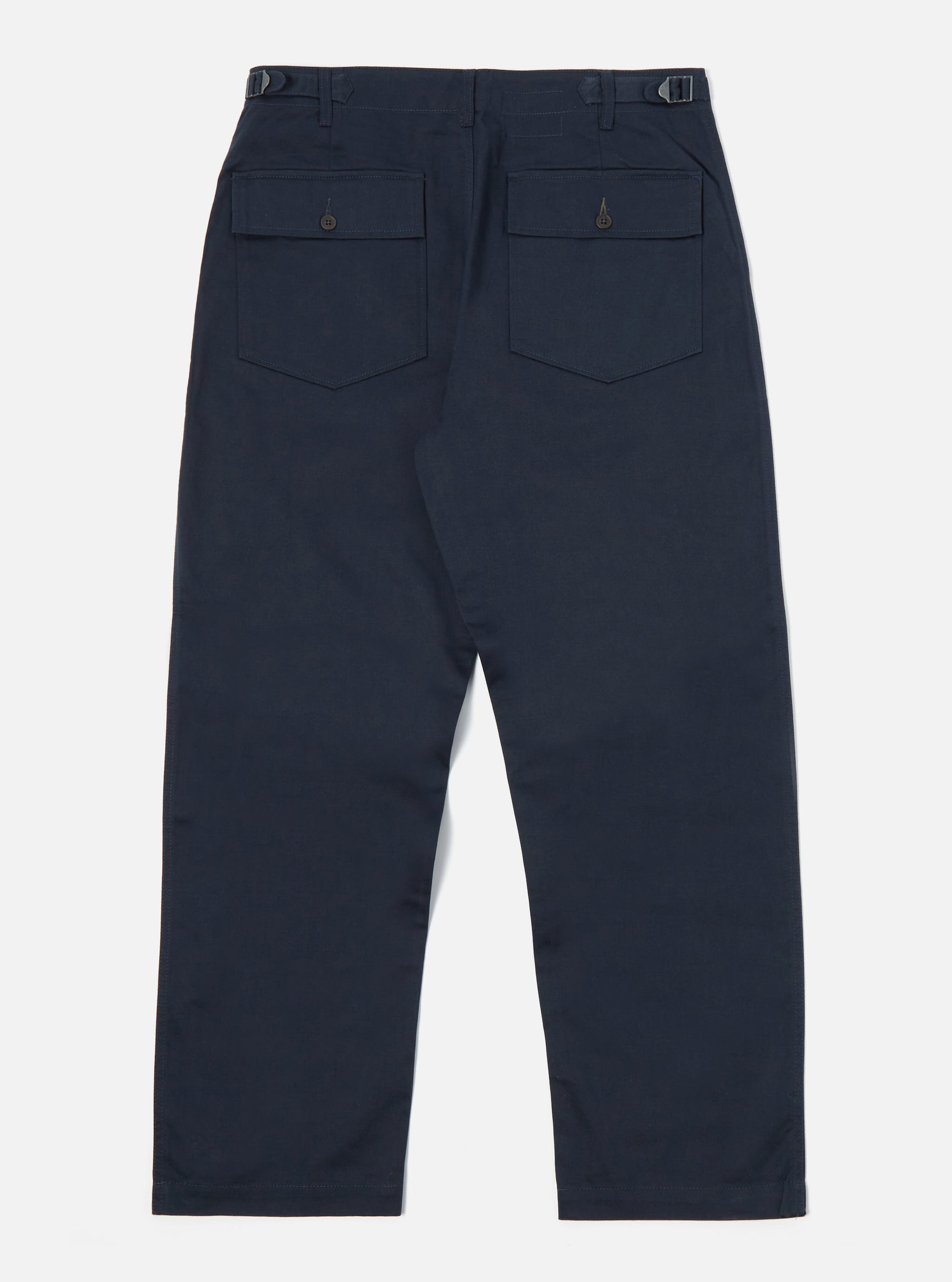 Back view of the Navy Twill Fatigue Pant (Undarted) on a white background. The pants are a dark navy color and have two back pockets with button closures.