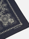 Close-up of a Navy Classic Bandana Neckerchief on a white background. The bandana has a paisley pattern in white ink. The fabric is a dark navy.