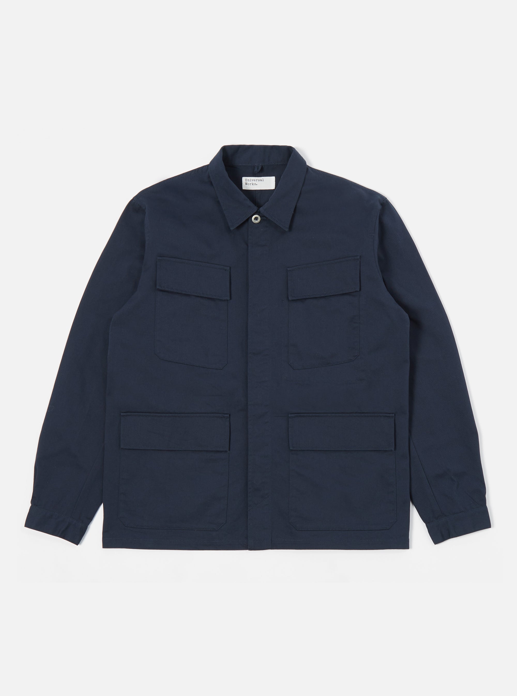 The Navy Twill MW Fatigue Jacket in navy twill on a white background. The jacket has a button closure and four front pockets.