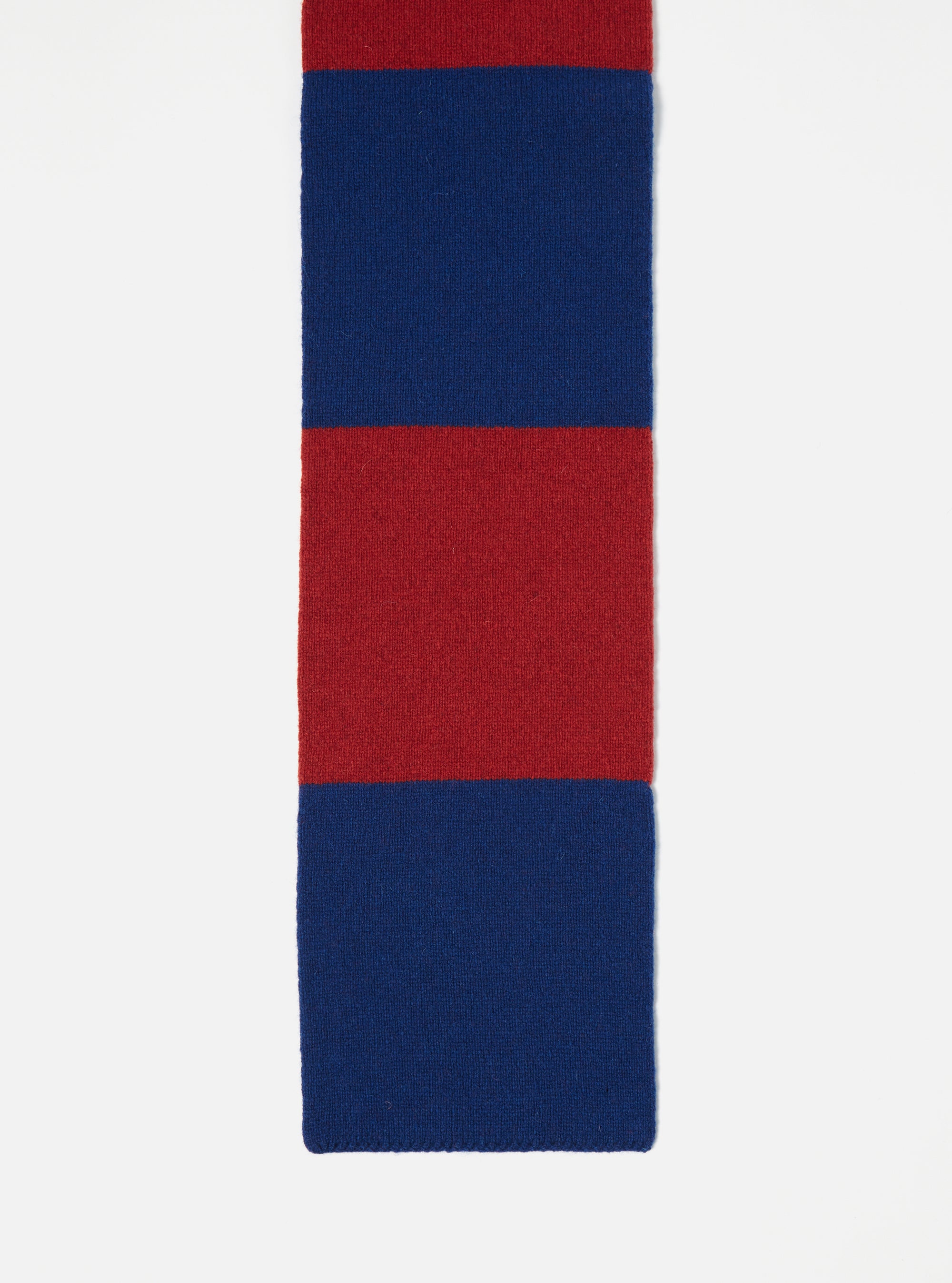Close-up of a Red/Blue Soft Wool Deluxe Football Scarf on a white background. The scarf features alternating red and blue stripes, showcasing its soft wool texture.