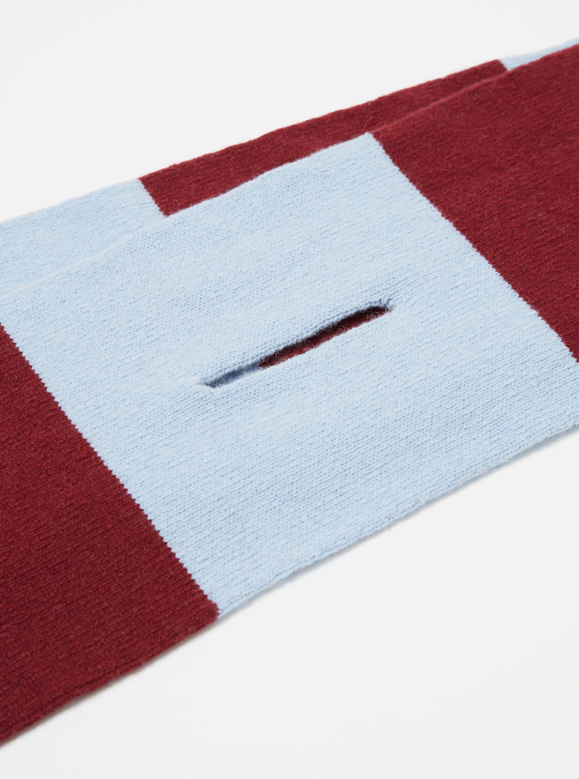 Close up of the Sky/Claret Soft Wool Deluxe Football Scarf on a white background. The scarf has sky blue and claret stripes and a slit.