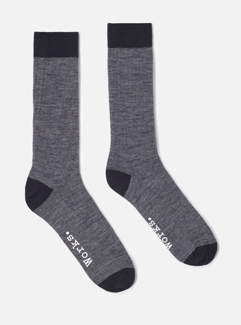 Studio shot of Grey Marl Merino Classic Sock. Merino wool socks are grey with black toe and cuff. Socks are on a white background.