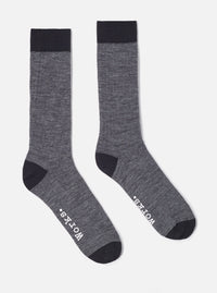 Studio shot of Grey Marl Merino Classic Sock. Merino wool socks are grey with black toe and cuff. Socks are on a white background.