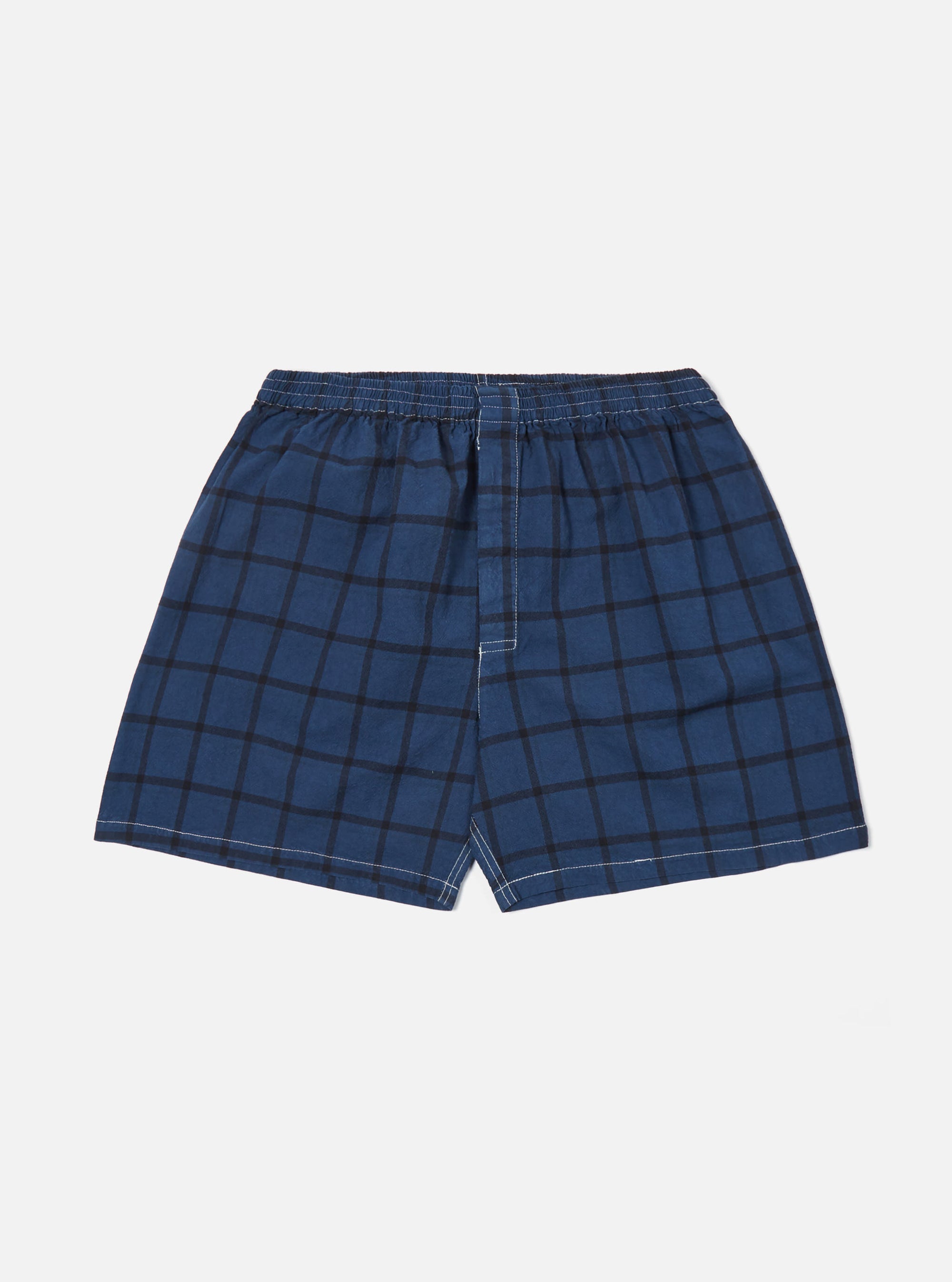 Studio shot of Blue Check Boxer Short on a white background. The boxer shorts are blue with a black check pattern and have an elastic waistband.